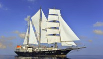 Sailing yacht RUNNING ON WAVES